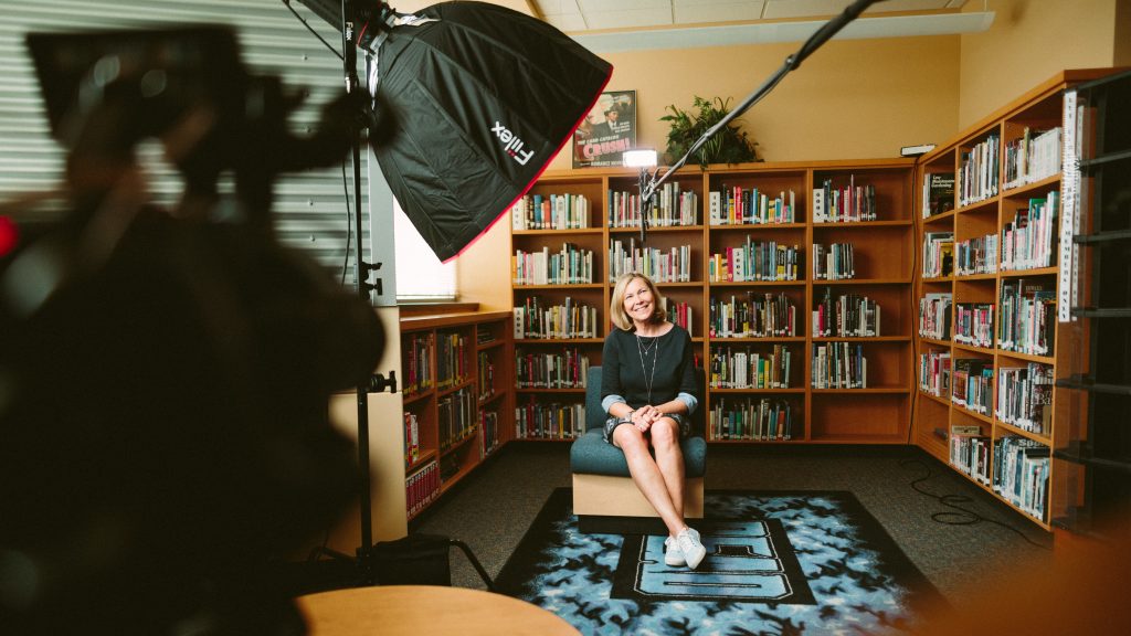 A woman being interviewed for a case study