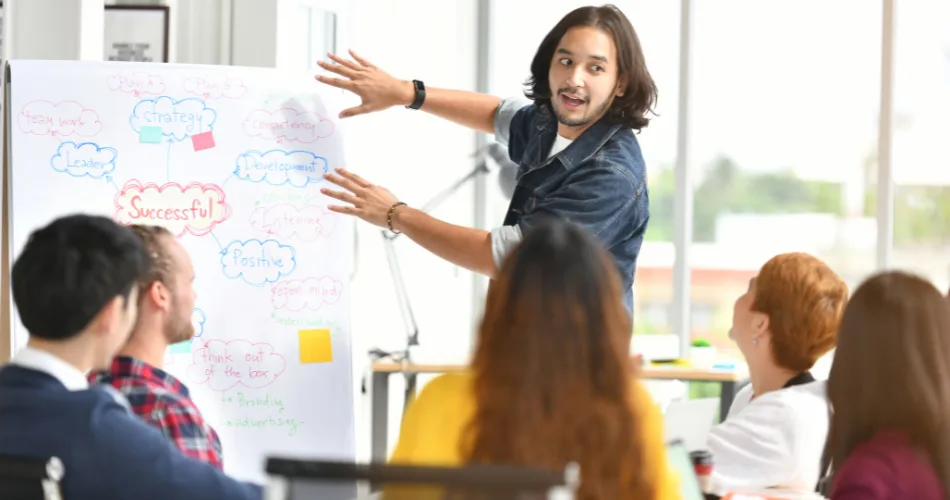 A man presenting content marketing trends to his team.