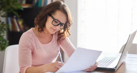 A woman writing a blog post